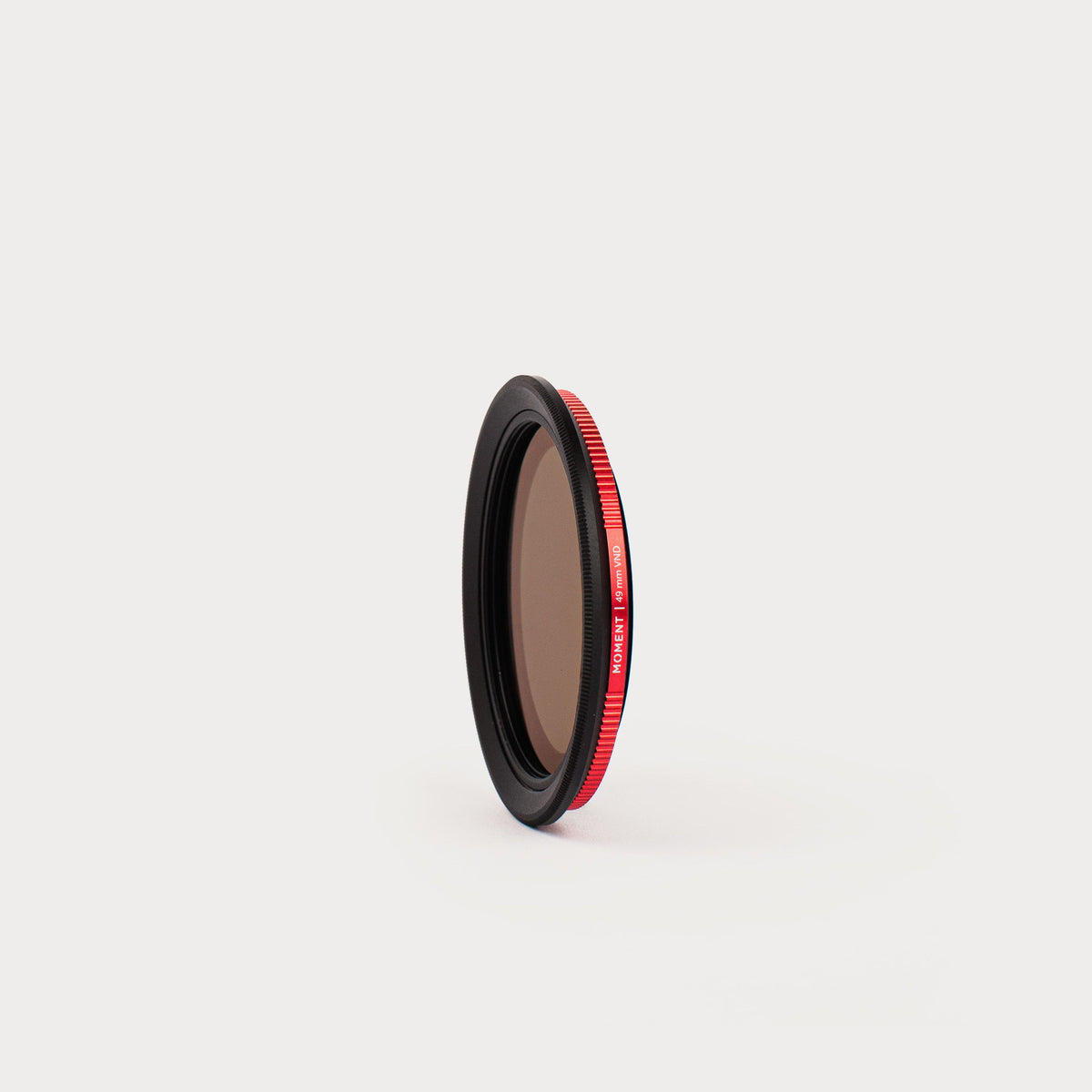 a close up of a camera filter on a white surface .