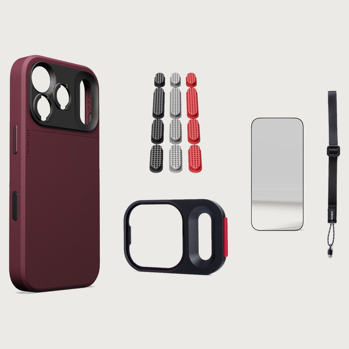 iphone-18-pro-case-essentials — Burgundy case, Metal Grip Pack (Black/Silver/Red), Black wrist strap (AR glass + CineClear UV; no drop-in / no cleaning kit)