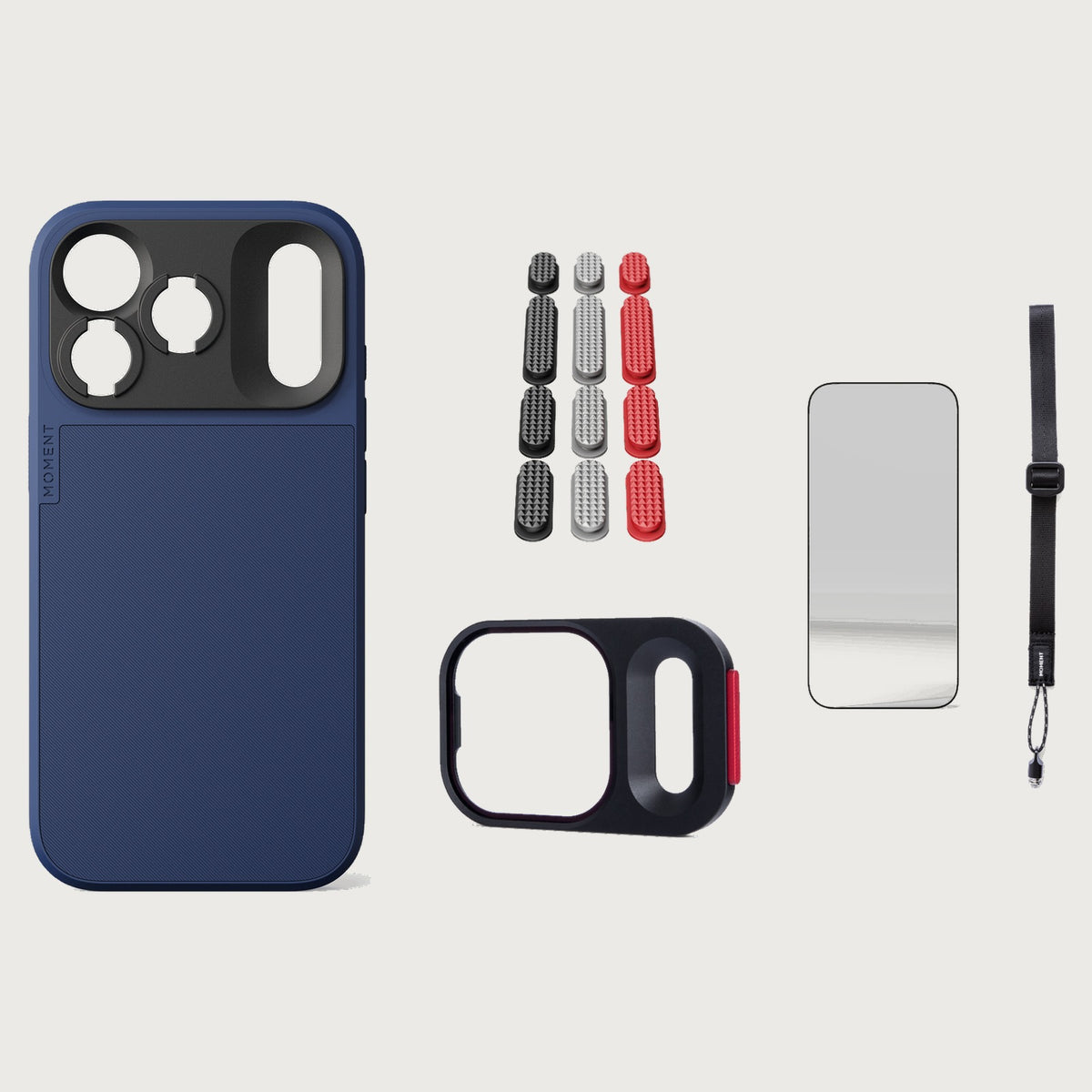 iphone-18-pro-case-essentials — Indigo case, Metal Grip Pack (Black/Silver/Red), Burgundy wrist strap (AR glass + CineClear UV; no drop-in / no cleaning kit)