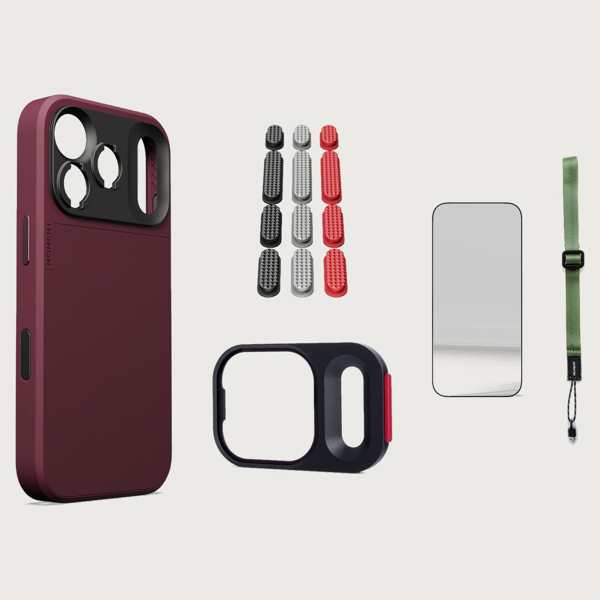 iphone-18-pro-max-case-essentials — Burgundy case, Metal Grip Pack (Black/Silver/Red), Olive wrist strap (AR glass + CineClear UV; no drop-in / no cleaning kit)