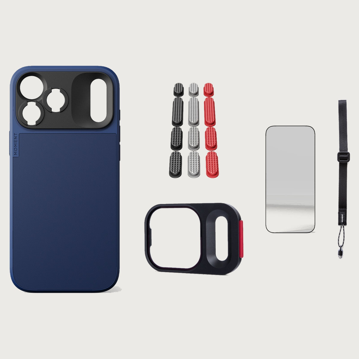 iphone-18-pro-max-case-essentials — Indigo case, Metal Grip Pack (Black/Silver/Red), Desert wrist strap (AR glass + CineClear UV; no drop-in / no cleaning kit)
