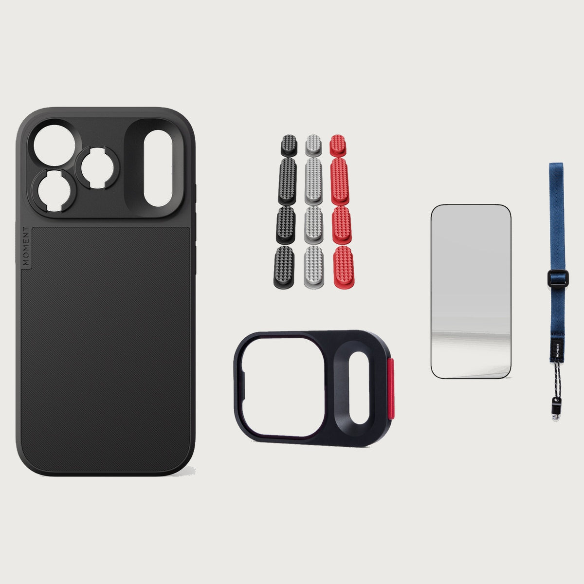 iphone-18-pro-case-essentials — Black case, Metal Grip Pack (Black/Silver/Red), Indigo wrist strap (AR glass + CineClear UV; no drop-in / no cleaning kit)