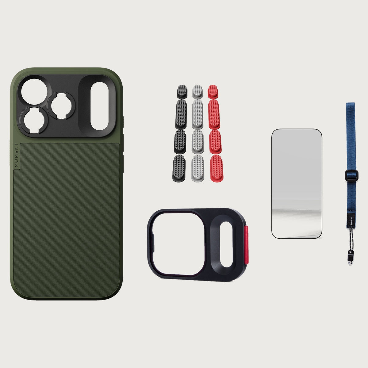 iphone-18-pro-case-essentials — Olive case, Metal Grip Pack (Black/Silver/Red), Indigo wrist strap (AR glass + CineClear UV; no drop-in / no cleaning kit)